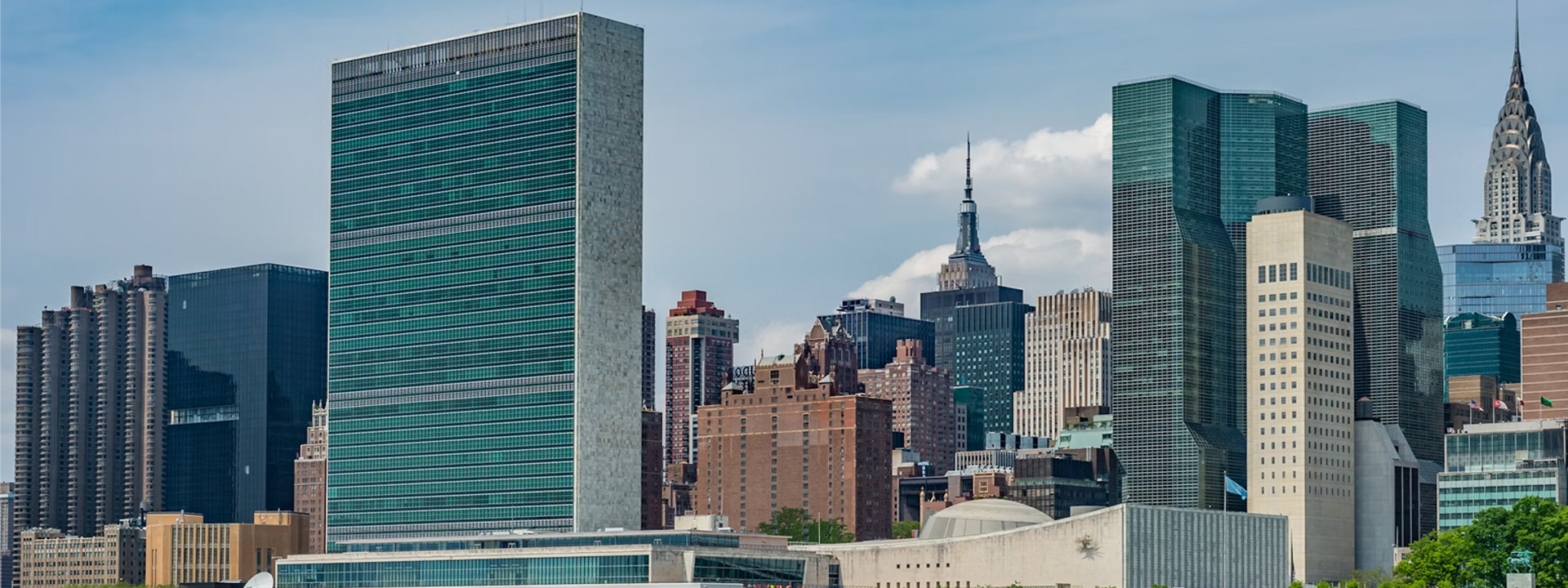 city buildings near body of water during daytime