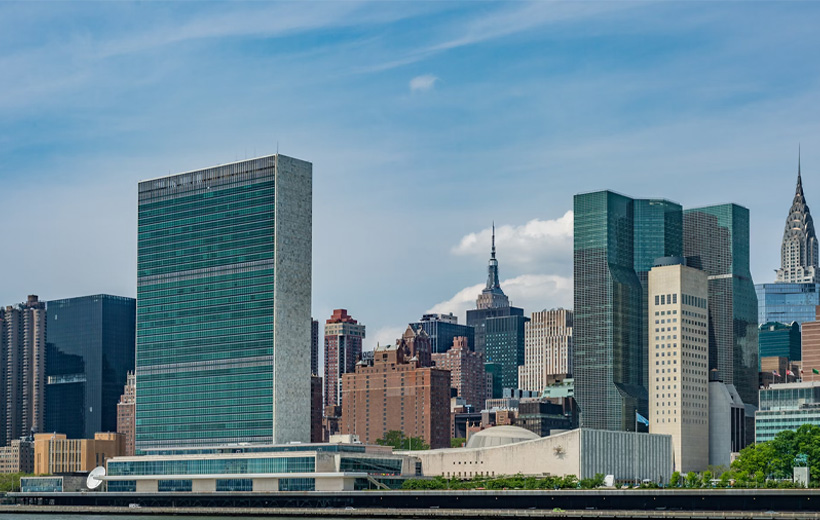 city buildings near body of water during daytime