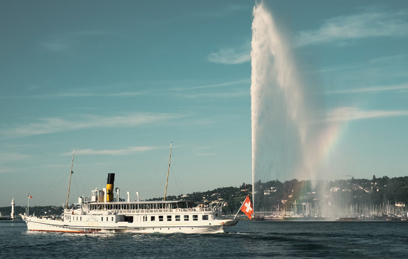 white ship on water fountain under blue sky during daytime