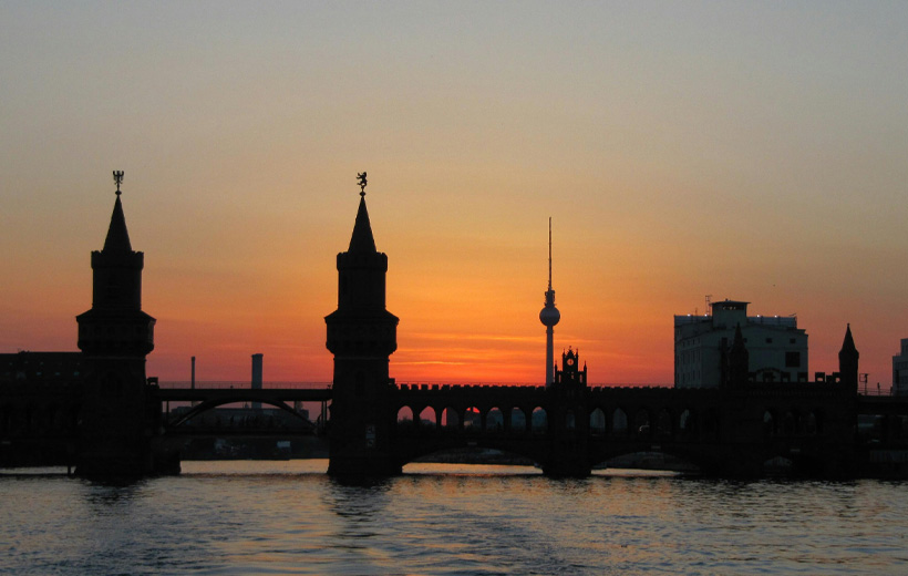 Silhouette of Bridge on Body of Water during Golden Hour