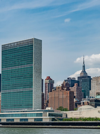 city buildings near body of water during daytime