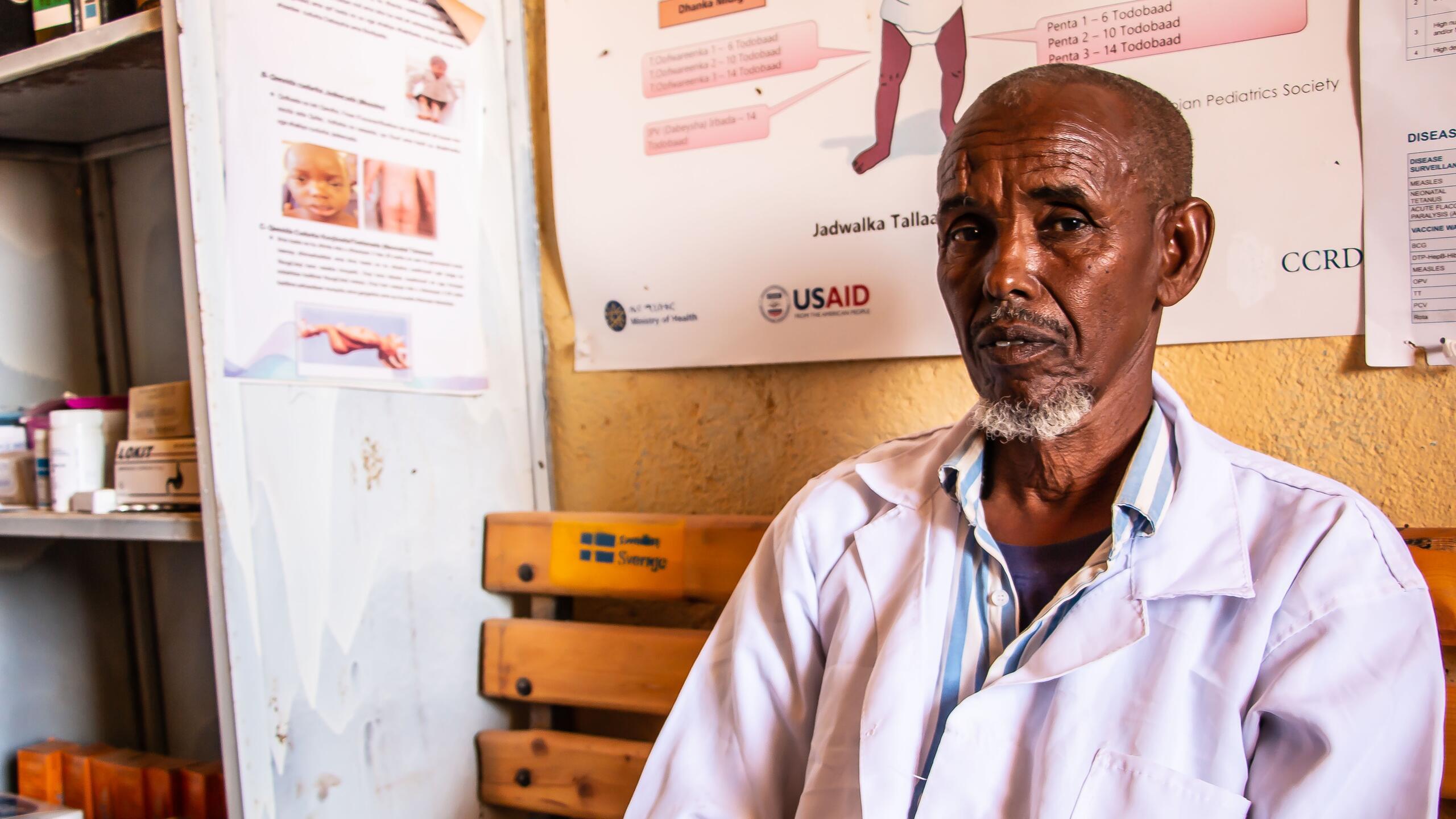 A man sits in a health centre.