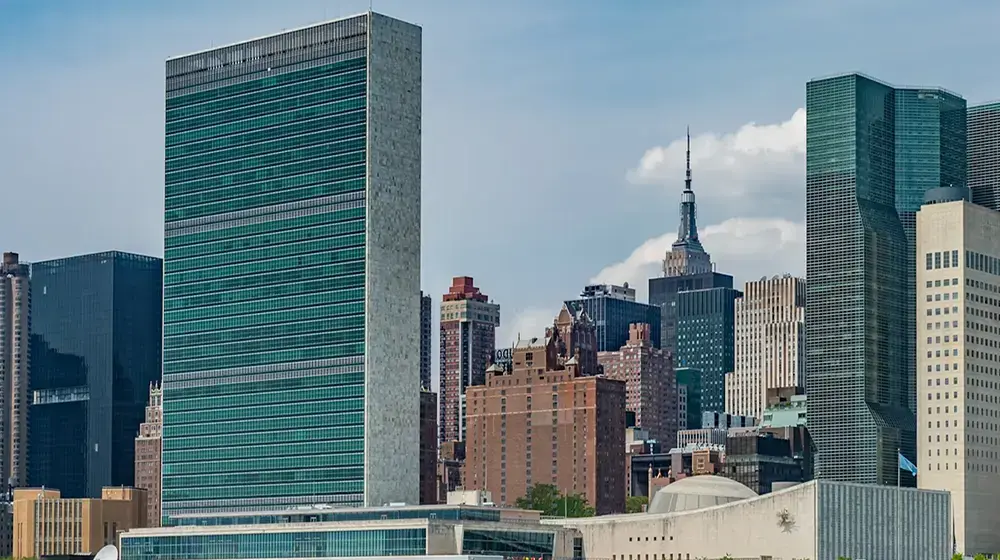 city buildings near body of water during daytime