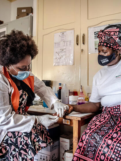 A woman receives a HIV test.